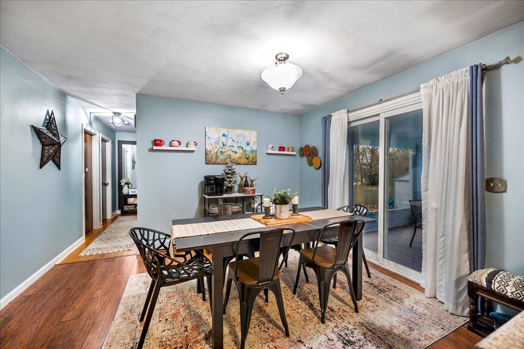 63 Hebb Street Somerset, MA 02725 - Photo 12 of 30 a view of a dining room with furniture and a chandelier
