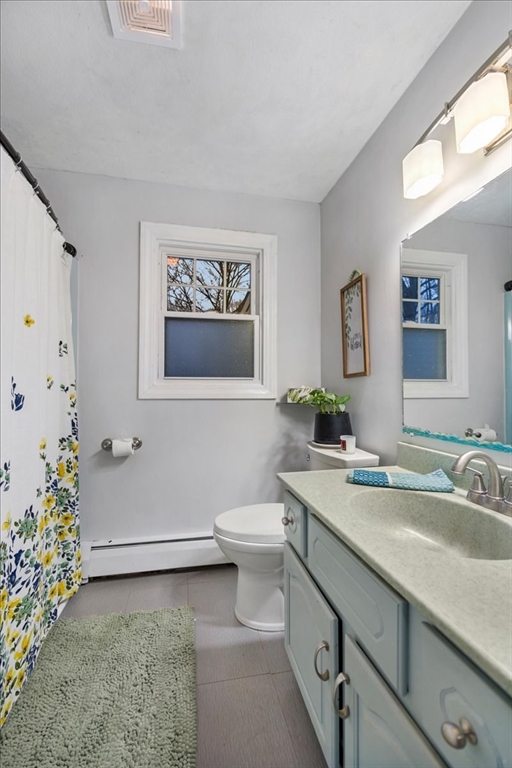 63 Hebb Street Somerset, MA 02725 - Photo 15 of 30 a bathroom with a sink a toilet and with mirror