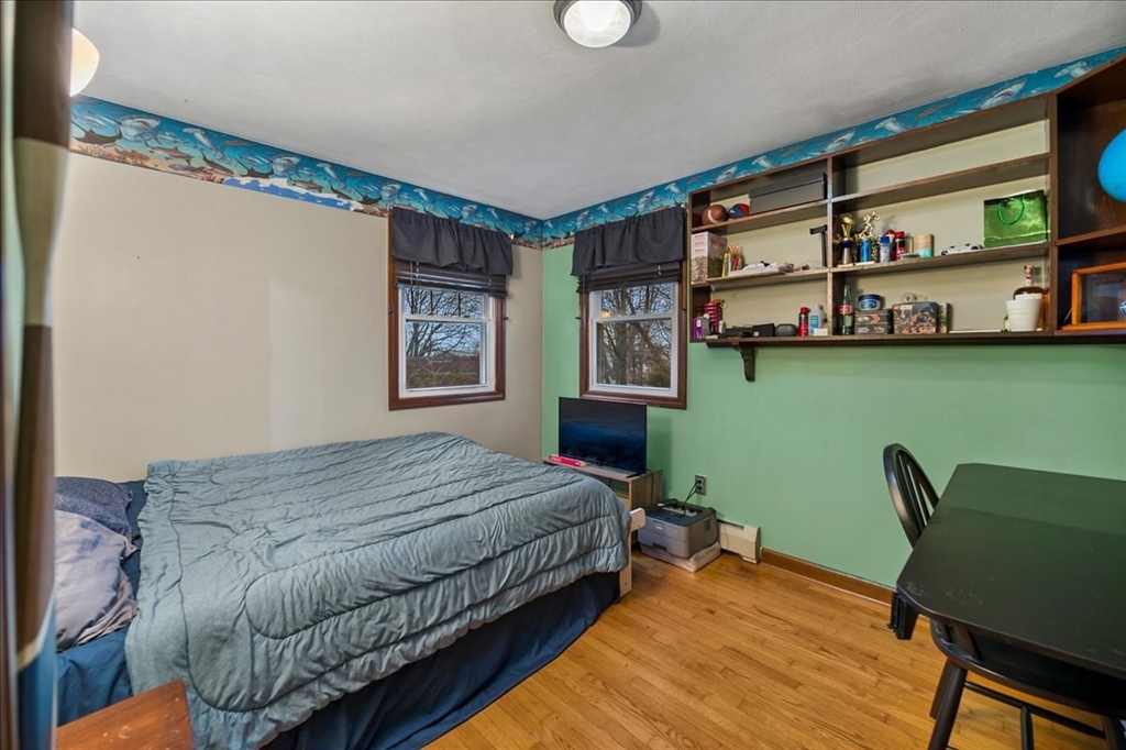 63 Hebb Street Somerset, MA 02725 - Photo 16 of 30 a bedroom with a bed window and a chair