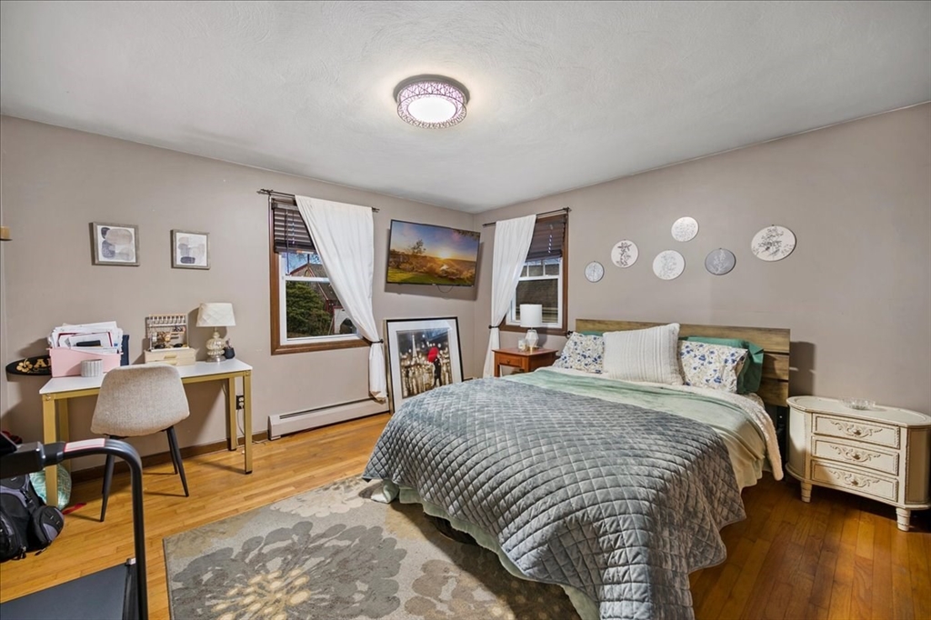 63 Hebb Street Somerset, MA 02725 - Photo 18 of 30 a bedroom with a bed a table and chair