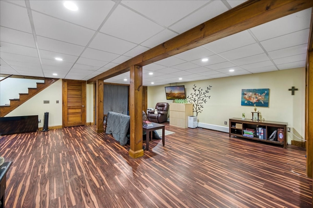 63 Hebb Street Somerset, MA 02725 - Photo 24 of 30 a view of a living room a dining room with furniture wooden floor and window