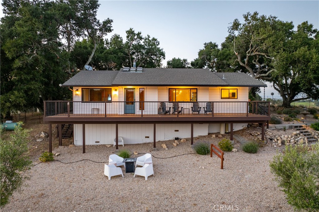 115 Booker Road Templeton, CA 93465 - Photo 1 of 1 a view of a swimming pool with potted plants and large trees