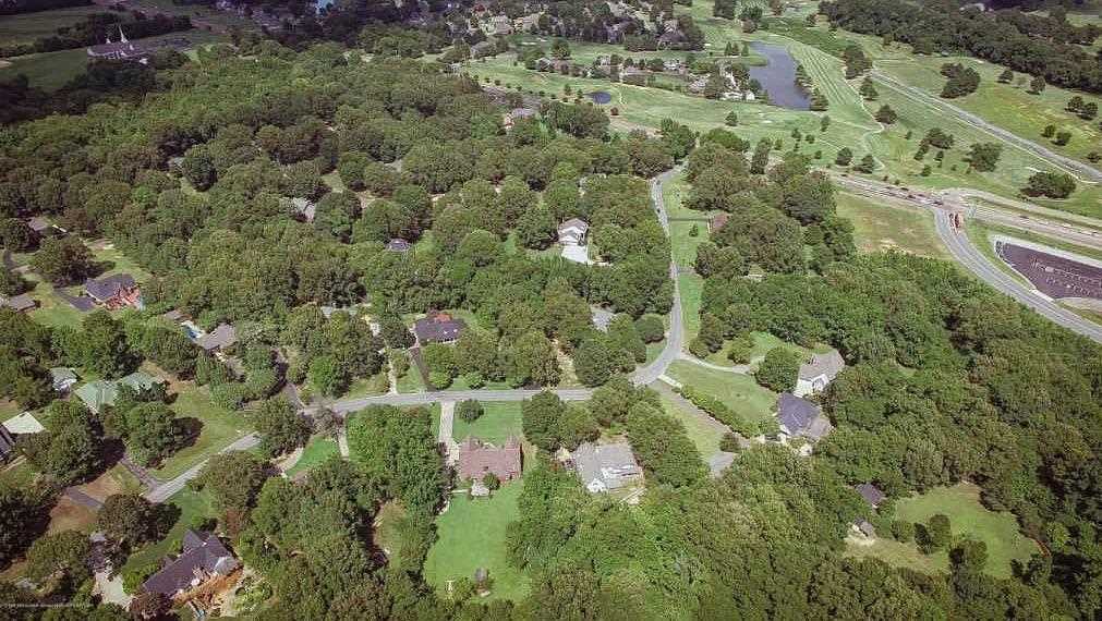8626 Lamar Road Olive Branch, MS 38654 - Photo 15 of 20 an aerial view of residential houses with outdoor space and trees
