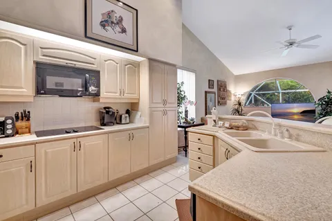 a bathroom with a glass shower door and a mirror
