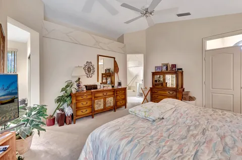 a view of a backyard with a swimming pool