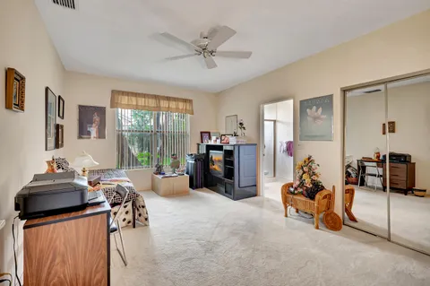 a view of a chairs and table in patio with a lake view