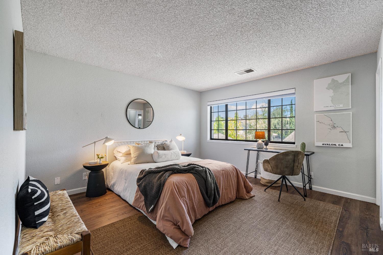 1740 Stuart Court Benicia, CA 94510 - Photo 19 of 38 a bedroom with a bed and a table