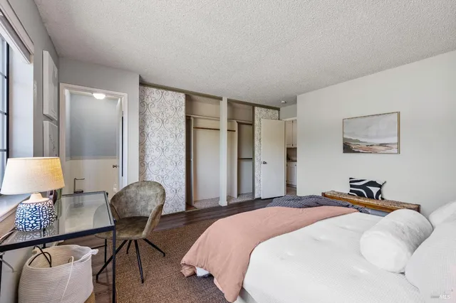 a bedroom with bed and a lamp