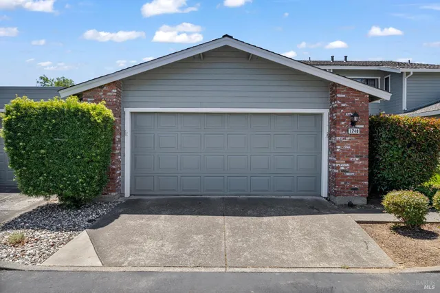a flower plants in front of a house