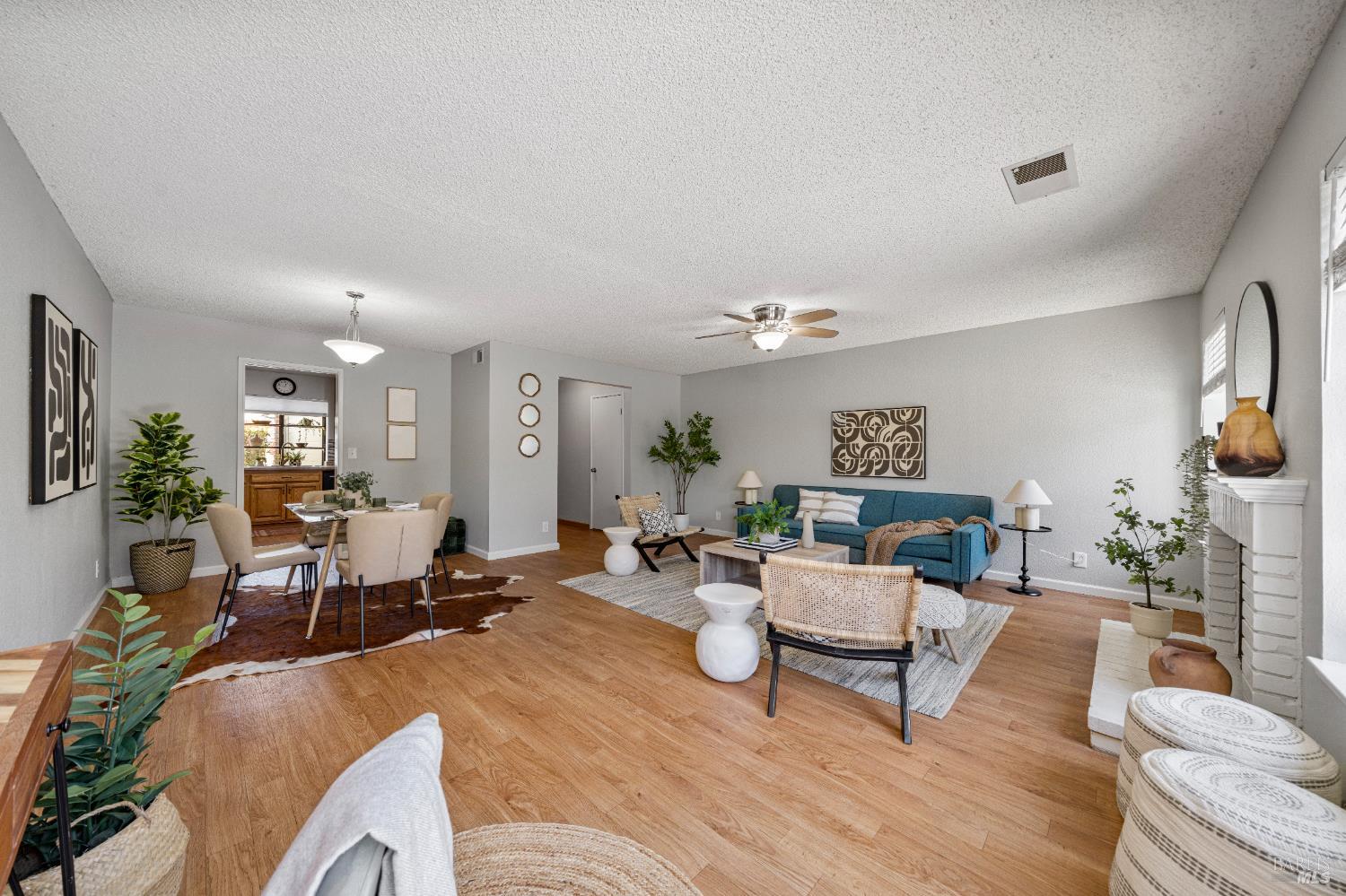 1740 Stuart Court Benicia, CA 94510 - Photo 6 of 38 a living room with furniture and a lamp