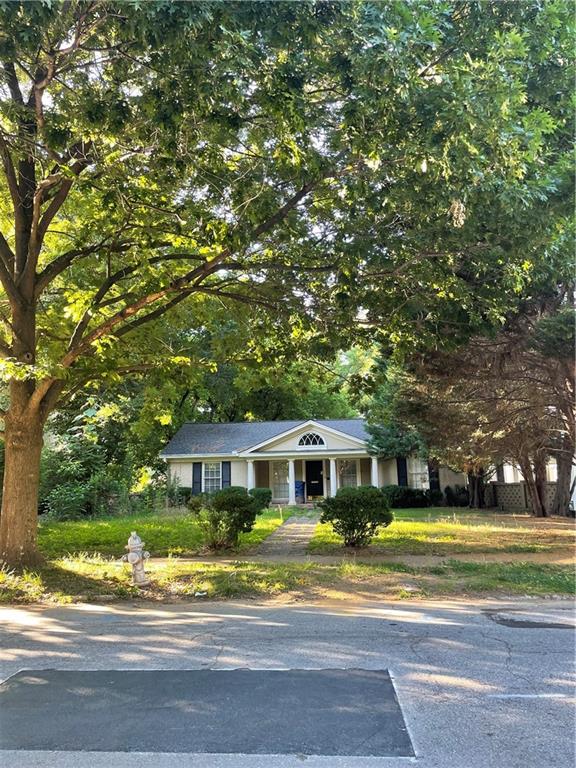 25 26th Street Northwest Atlanta, GA 30309 - Photo 4 of 6 a front view of a house with a yard