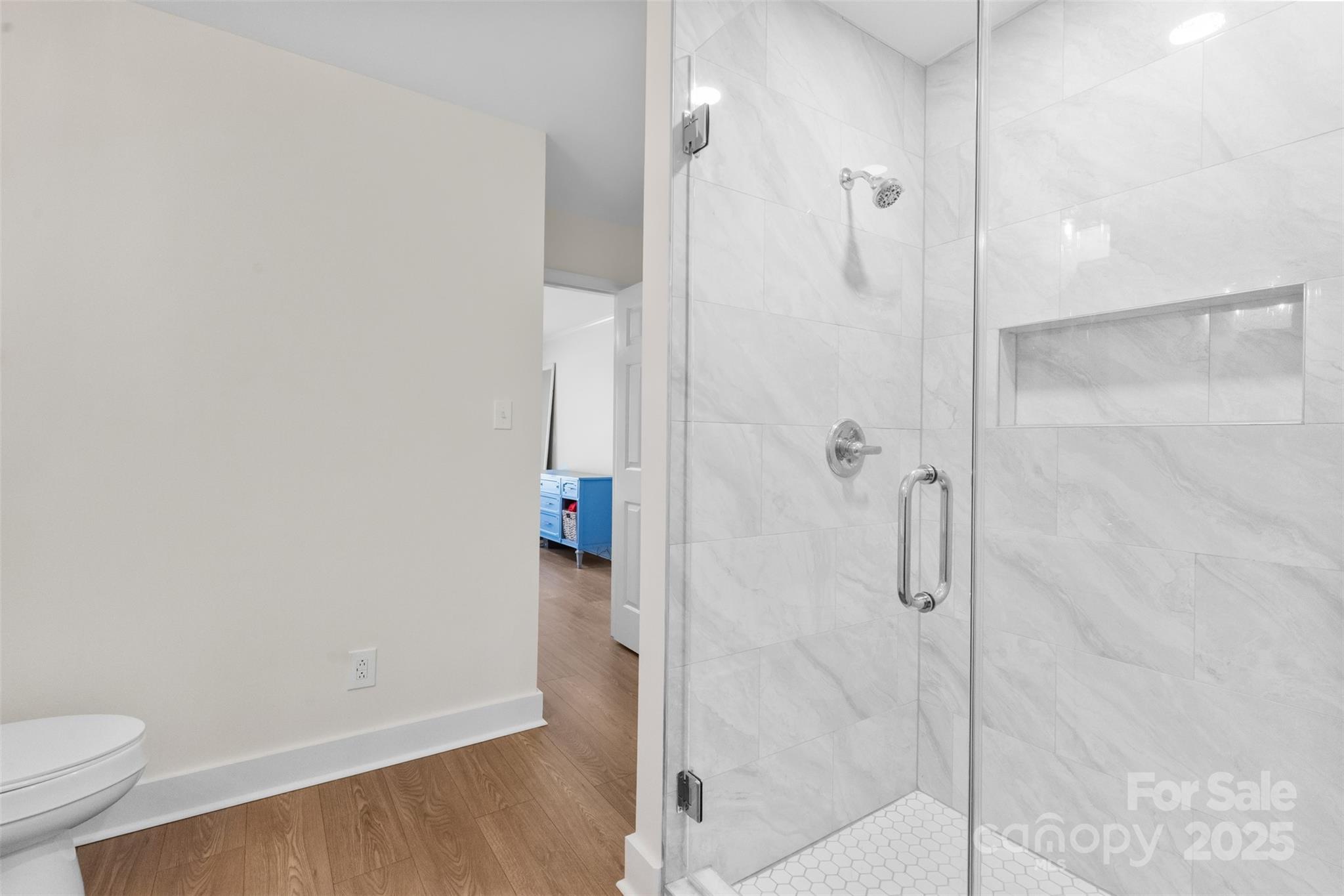 3407 Stonegate Road Monroe, NC 28110 - Photo 18 of 34 a bathroom with a shower and toilet