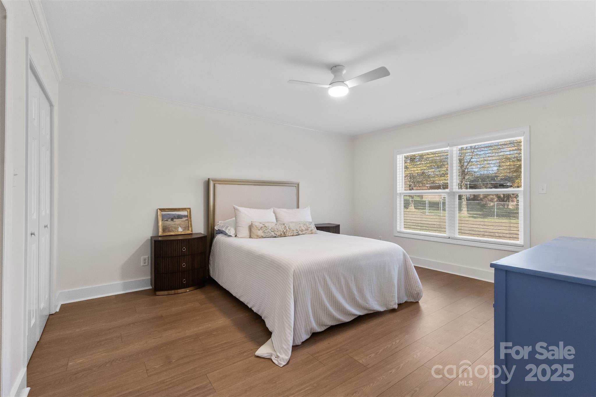 3407 Stonegate Road Monroe, NC 28110 - Photo 19 of 34 a bedroom with a bed and a large window