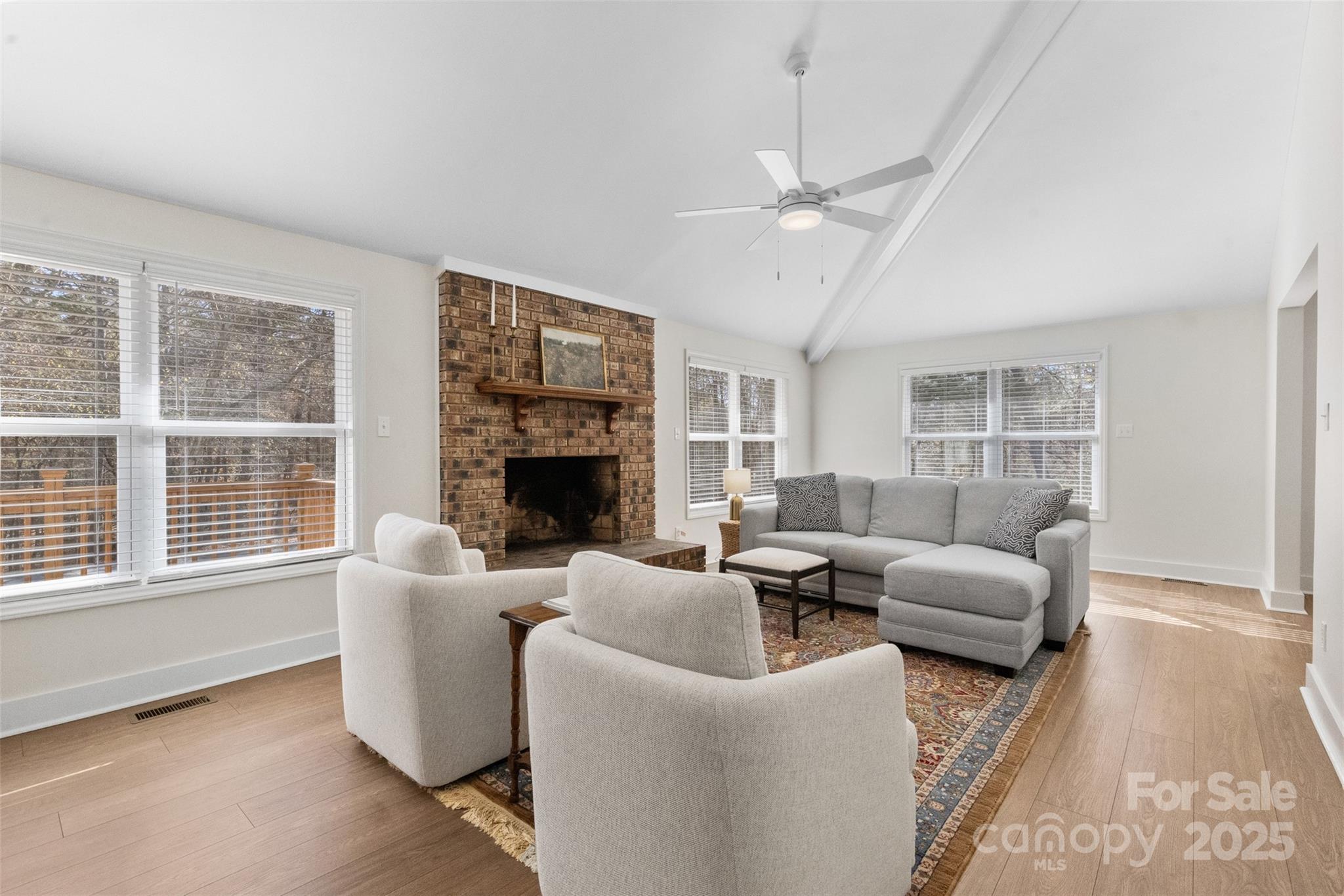 3407 Stonegate Road Monroe, NC 28110 - Photo 2 of 34 a living room with furniture a large window and a fireplace