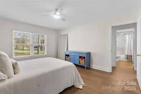 a spacious bedroom with a large bed and a fireplace