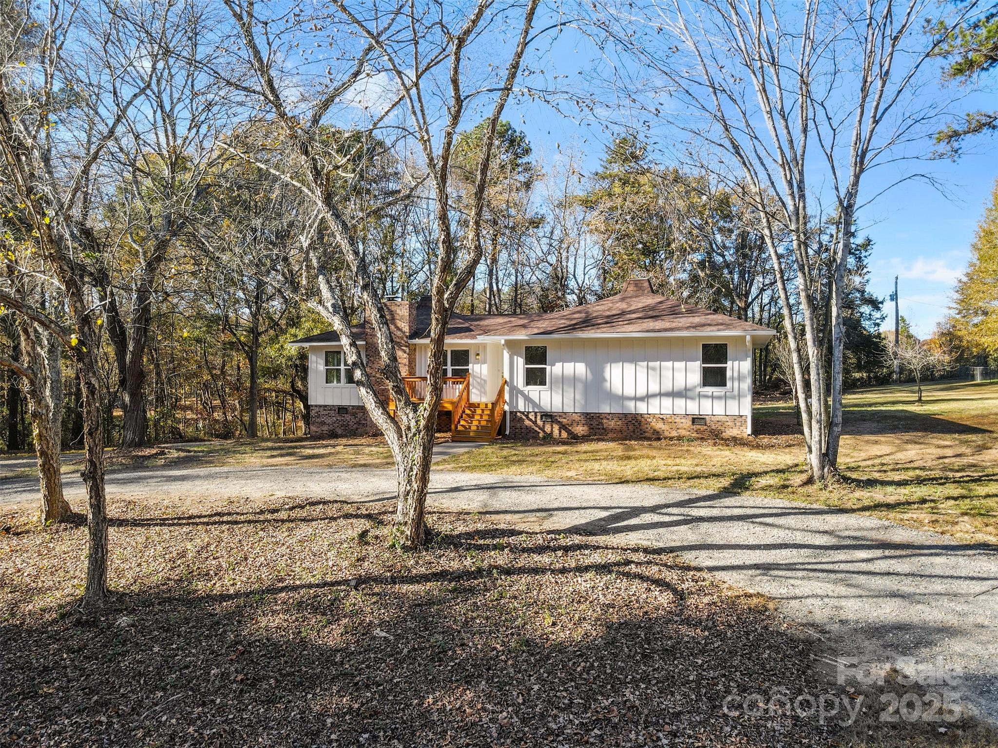 3407 Stonegate Road Monroe, NC 28110 - Photo 28 of 34 a view of a house with car parked next to a road