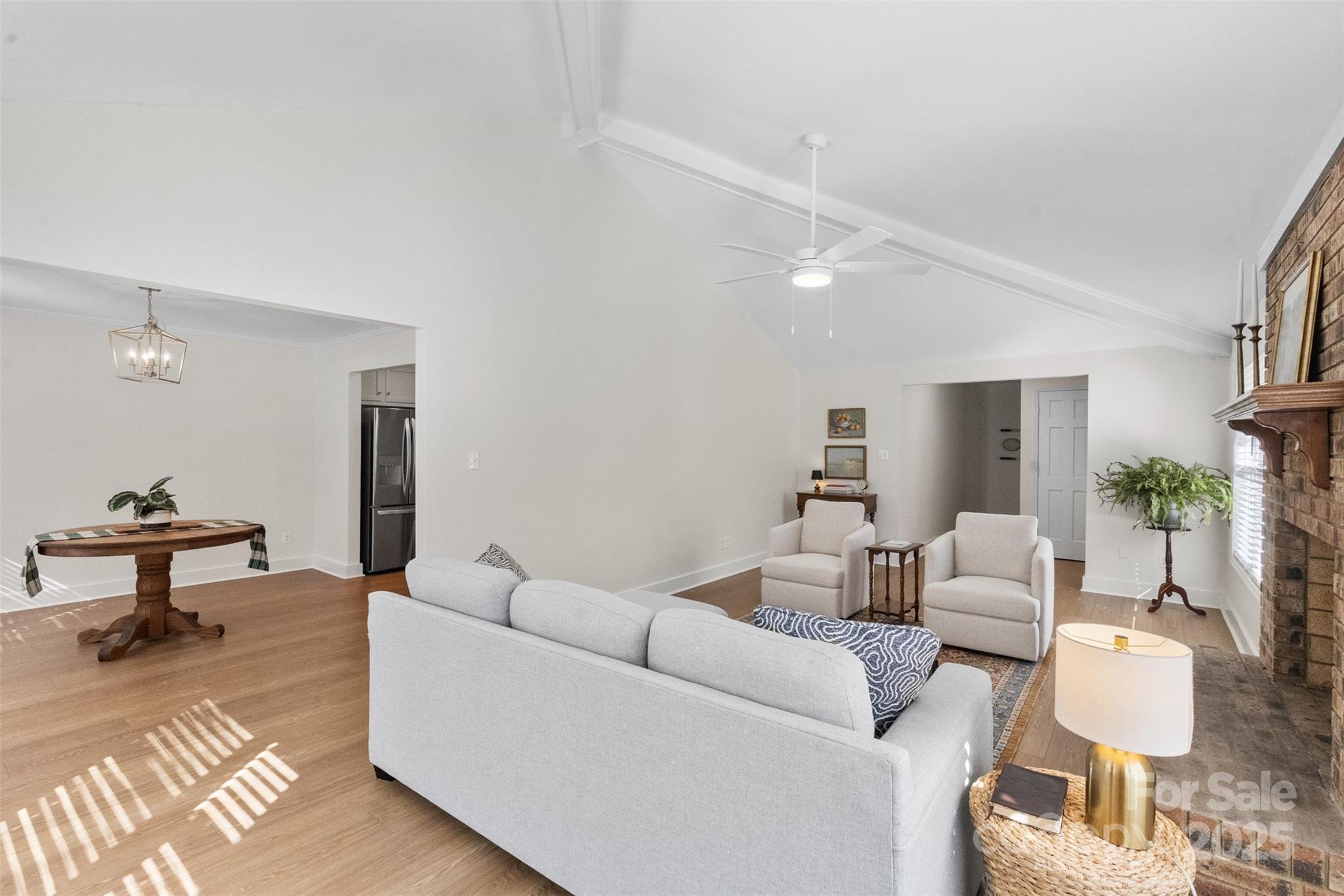 3407 Stonegate Road Monroe, NC 28110 - Photo 5 of 34 a living room with furniture and a table