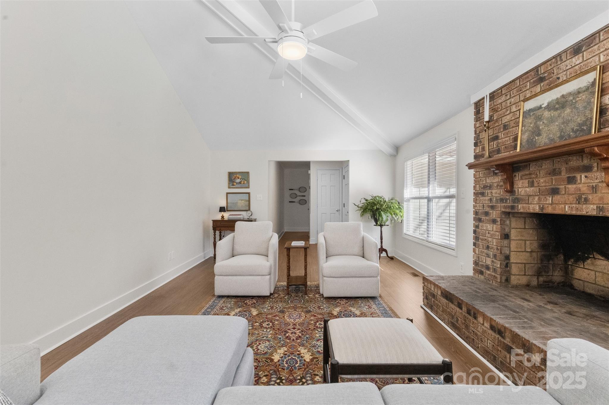 3407 Stonegate Road Monroe, NC 28110 - Photo 6 of 34 a living room with furniture and a fireplace