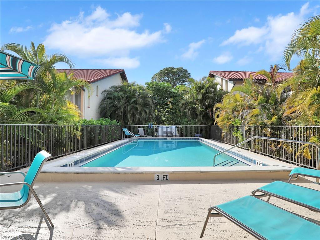 9831 Alabama Street, Unit 5 Bonita Springs, FL 34135 - Photo 26 of 28 Community pool with a patio area