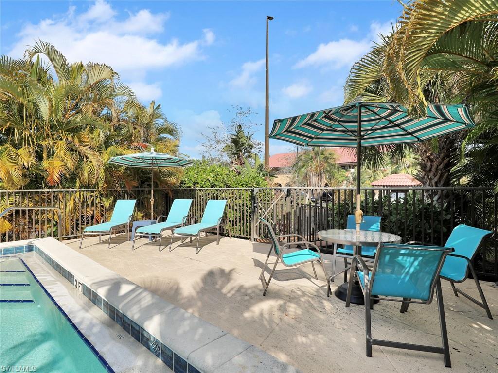 9831 Alabama Street, Unit 5 Bonita Springs, FL 34135 - Photo 27 of 28 View of patio with a pool and outdoor dining area