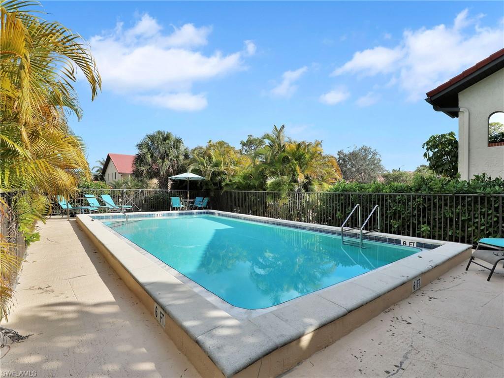 9831 Alabama Street, Unit 5 Bonita Springs, FL 34135 - Photo 28 of 28 Community pool featuring a patio area