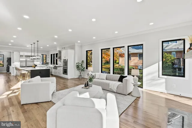 a large kitchen with lots of counter space and windows