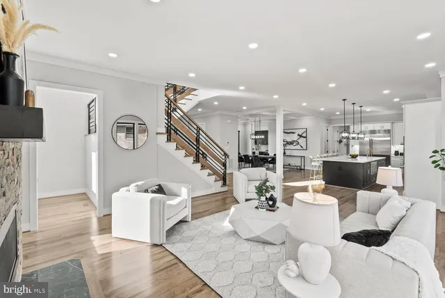 a kitchen with stainless steel appliances kitchen island granite countertop a stove a sink and a refrigerator