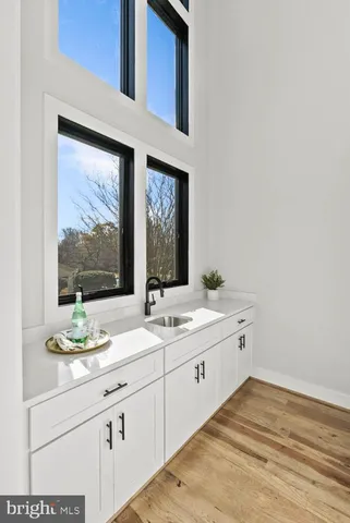 a bathroom with a sink toilet a mirror and shower