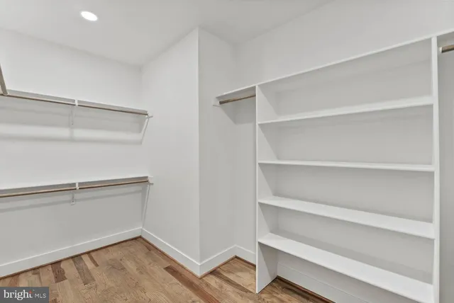 a view of a livingroom with a ceiling fan and window