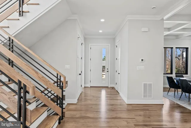 a living room with furniture wooden floor and a fireplace