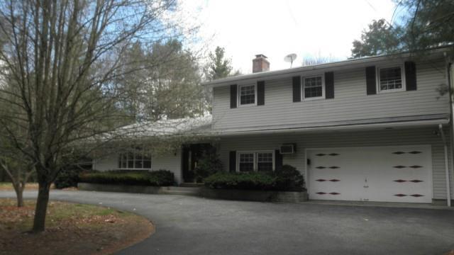 531 Lambert Road Orange, CT 06477 - Photo 1 of 1 a front view of a house with a yard
