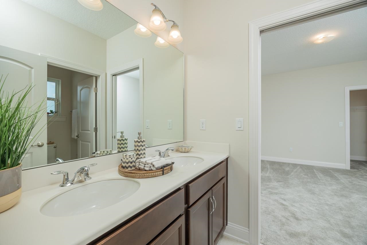 194 Snowbell Court St. Augustine, FL 32095 - Photo 17 of 75 a bathroom with a sink double vanity and a mirror