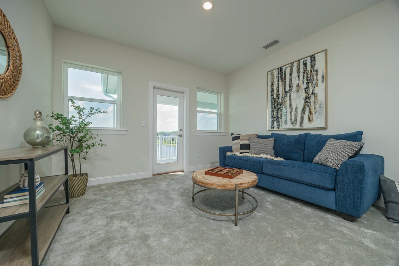 194 Snowbell Court St. Augustine, FL 32095 - Photo 22 of 75 a living room with furniture and a potted plant