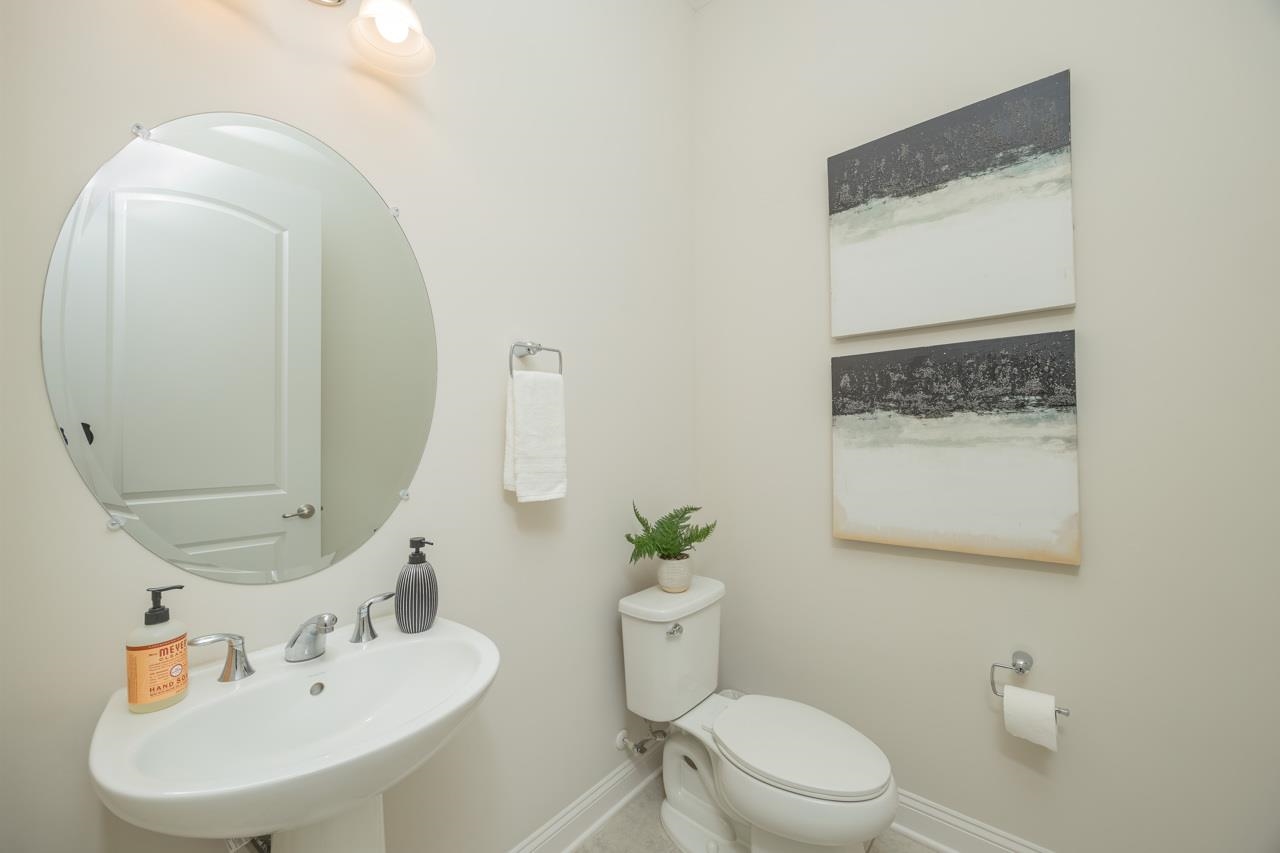 194 Snowbell Court St. Augustine, FL 32095 - Photo 42 of 75 a bathroom with a sink mirror and toilet
