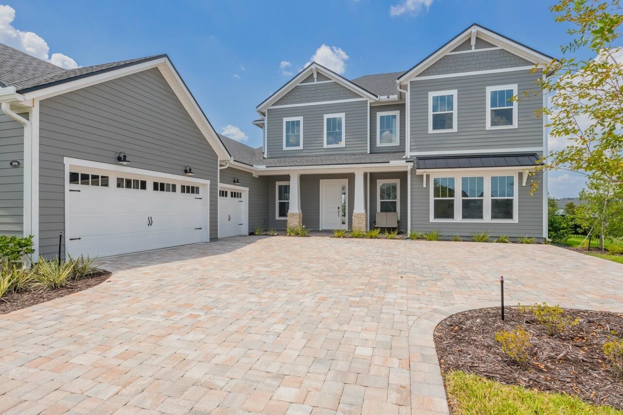 194 Snowbell Court St. Augustine, FL 32095 - Photo 47 of 75 a front view of a house with a rug and a garage