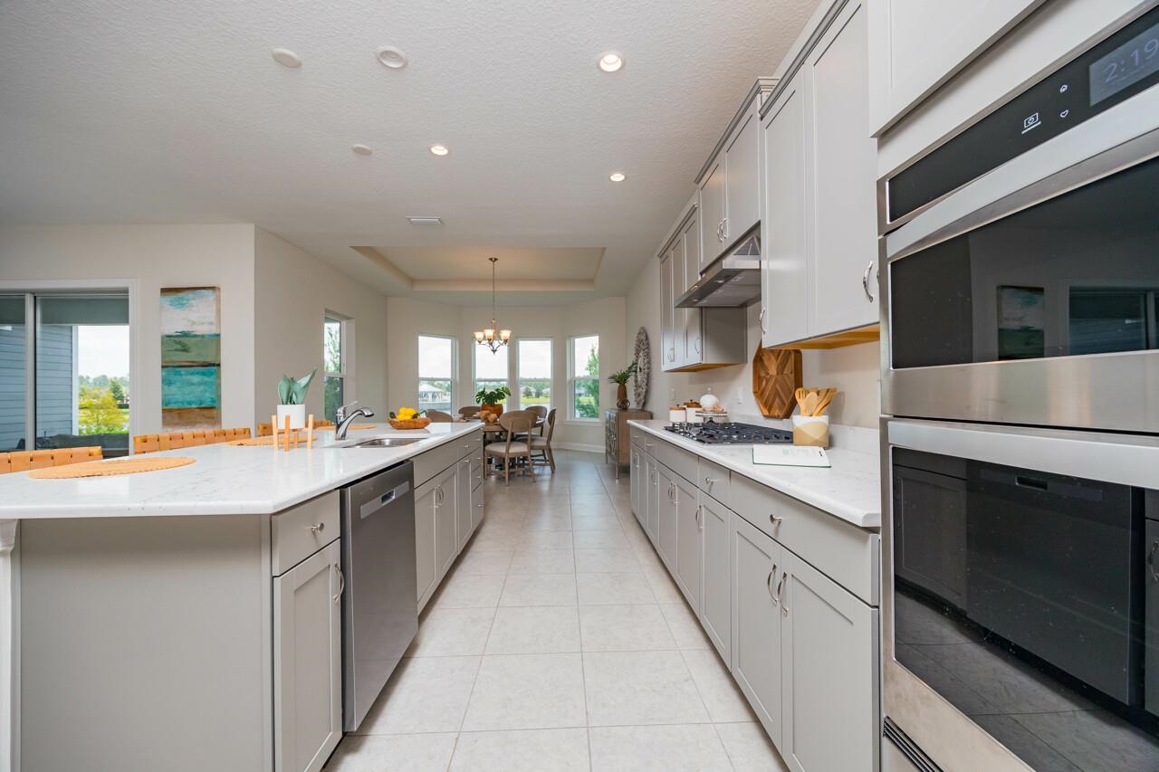 194 Snowbell Court St. Augustine, FL 32095 - Photo 54 of 75 a large kitchen with stainless steel appliances lots of counter top space