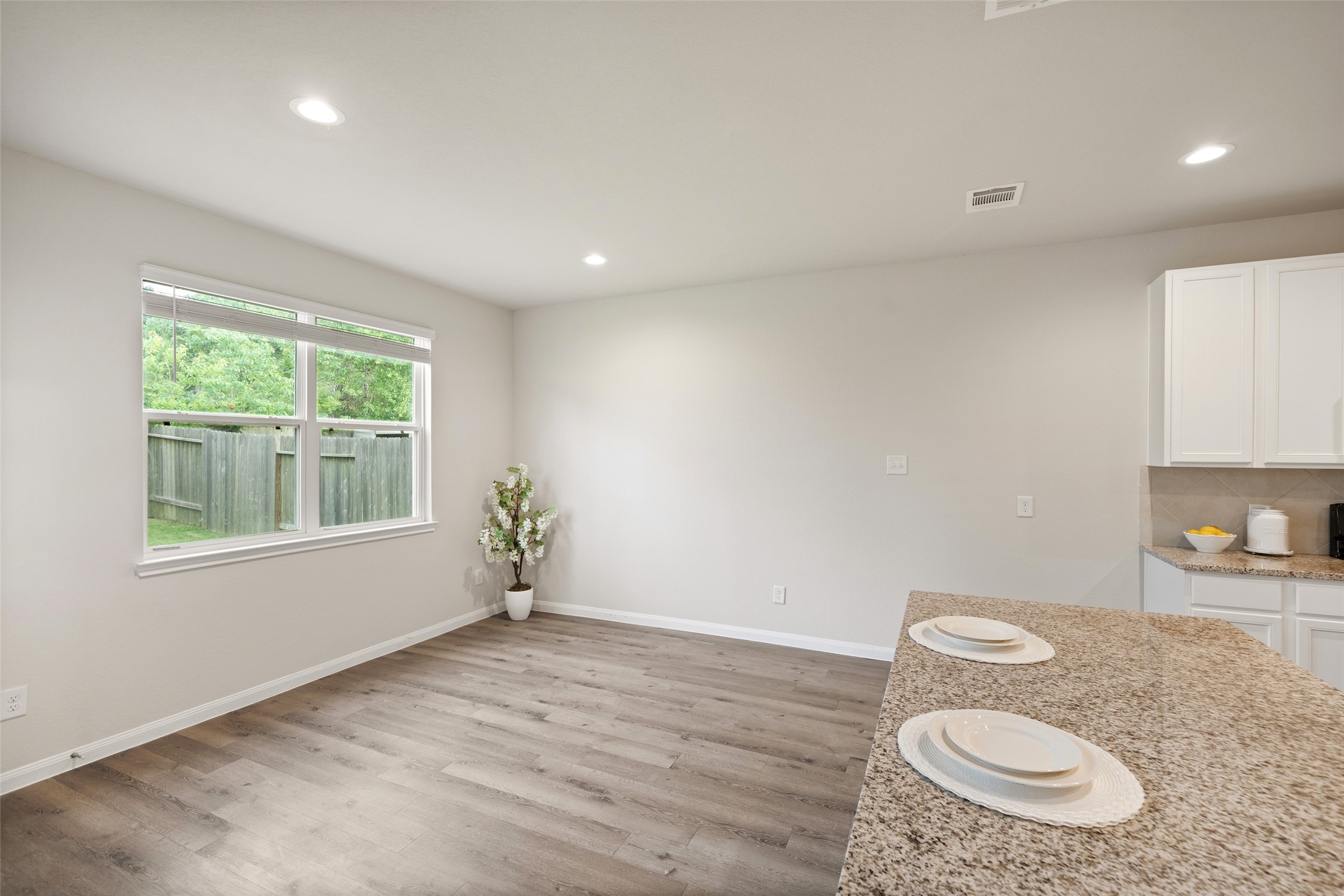3628 Cub Drive Conroe, TX 77301 - Photo 9 of 32 Plenty of space for a large dining table + bar seating.