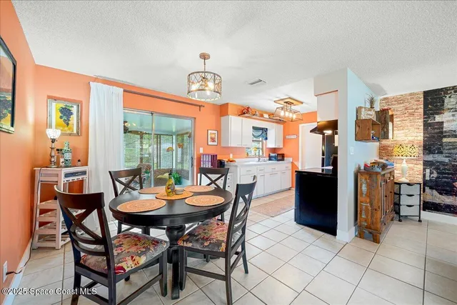 a dining room with a table and chairs