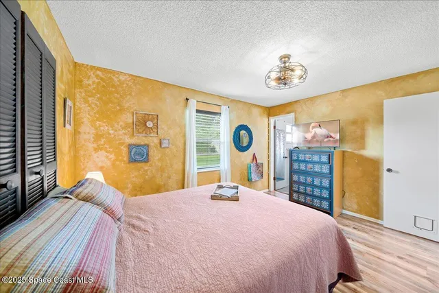 a bedroom with a large bed and a large bed