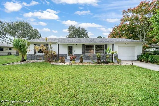 a front view of house with yard having outdoor seating