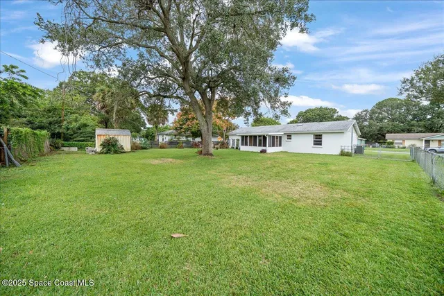 a view of a house with a big yard