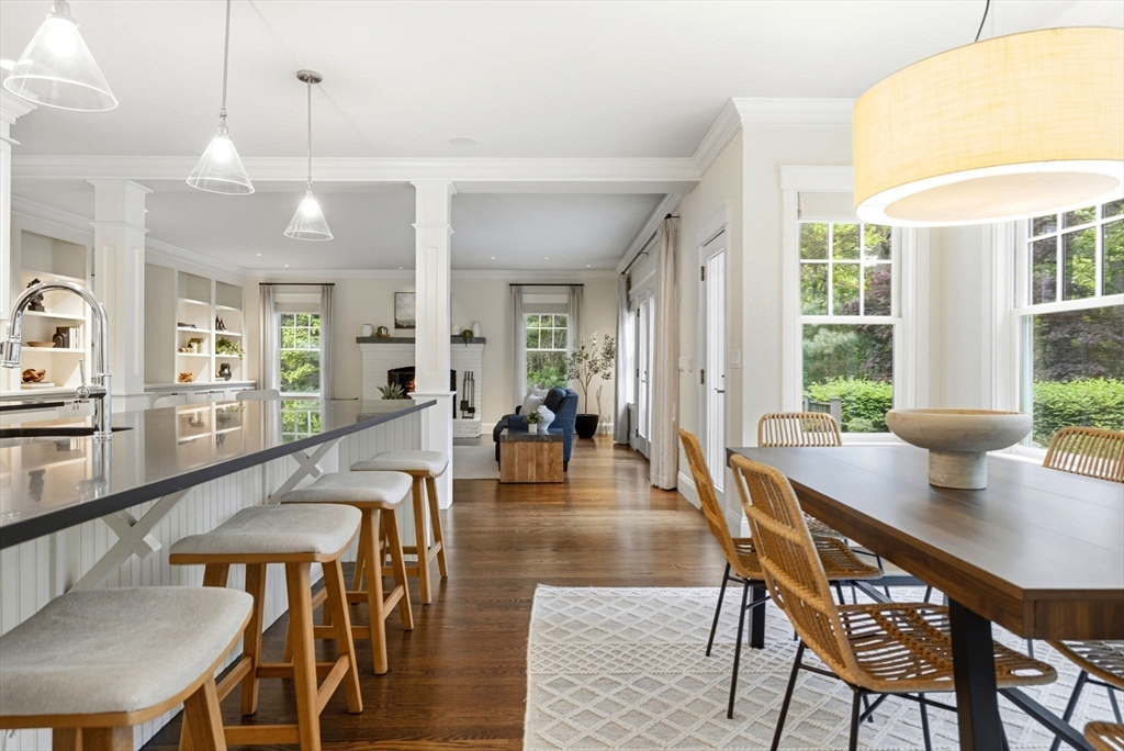 244 Musterfield Road Concord, MA 01742 - Photo 7 of 42 a dining room with furniture and wooden floor
