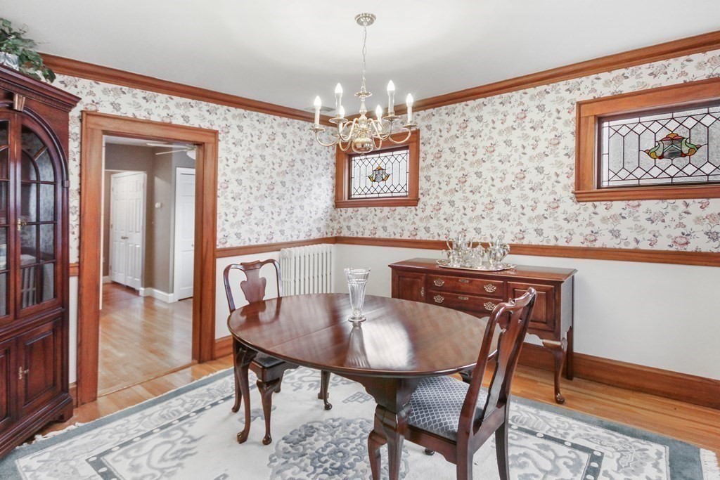 35 Standish Road Watertown, MA 02472 - Photo 11 of 33 a view of a dining room with furniture and wooden floor