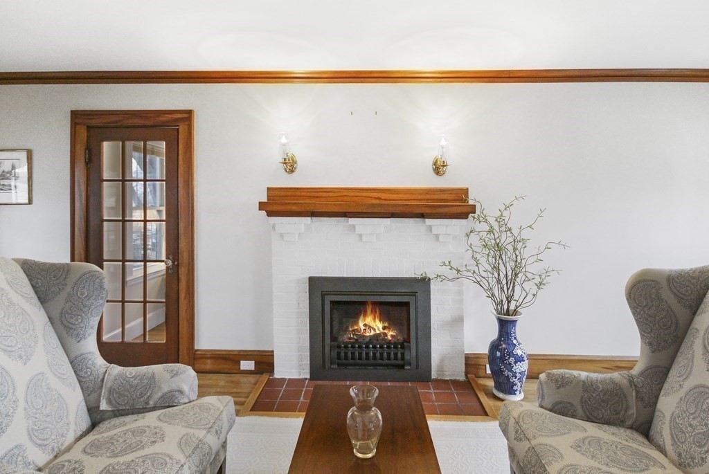 35 Standish Road Watertown, MA 02472 - Photo 3 of 33 a living room with furniture and a fireplace