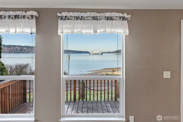 a bedroom with bed and a potted plant