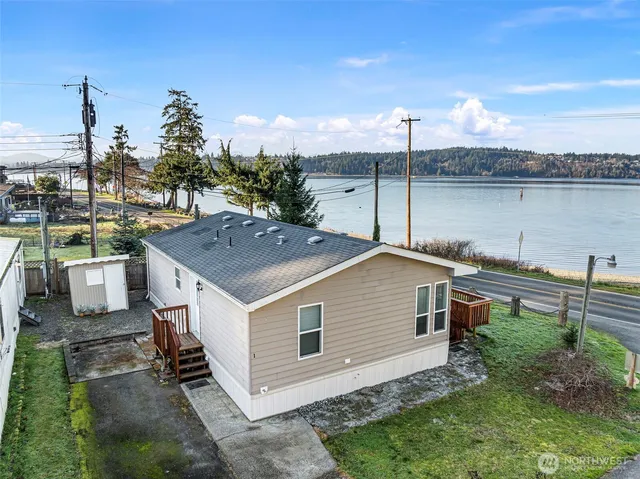 a view of an ocean beach and city