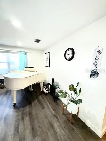 a view of a room with table and chairs