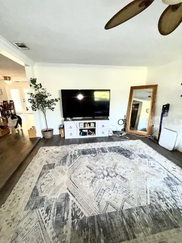 a view of a living room and a flat screen tv