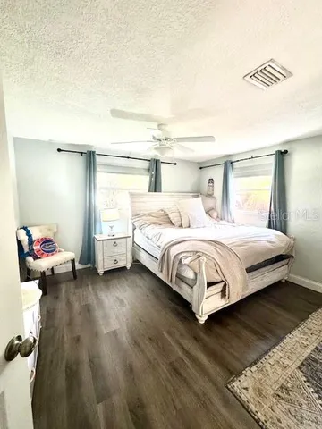 a bedroom with a bed and a cabinets