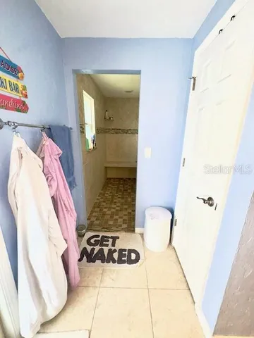 a bathroom with a bathtub and shower